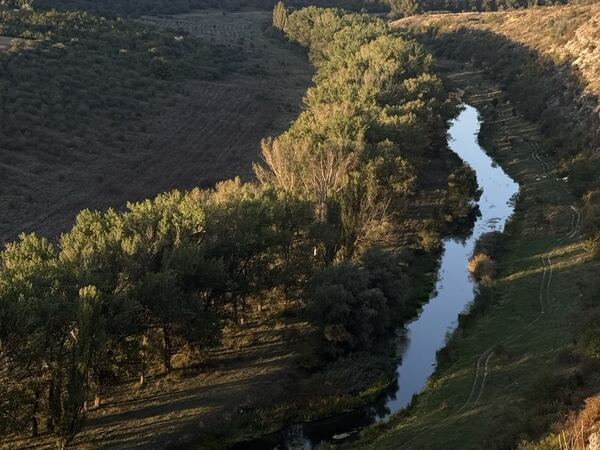 A river winding through a green valley in Moldova