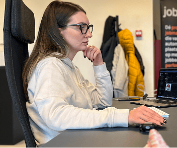 BinarCode team member at their desk